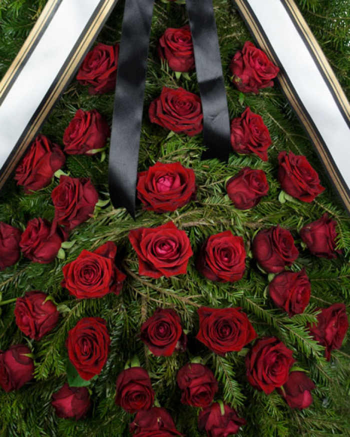 Funeral wreath with red roses