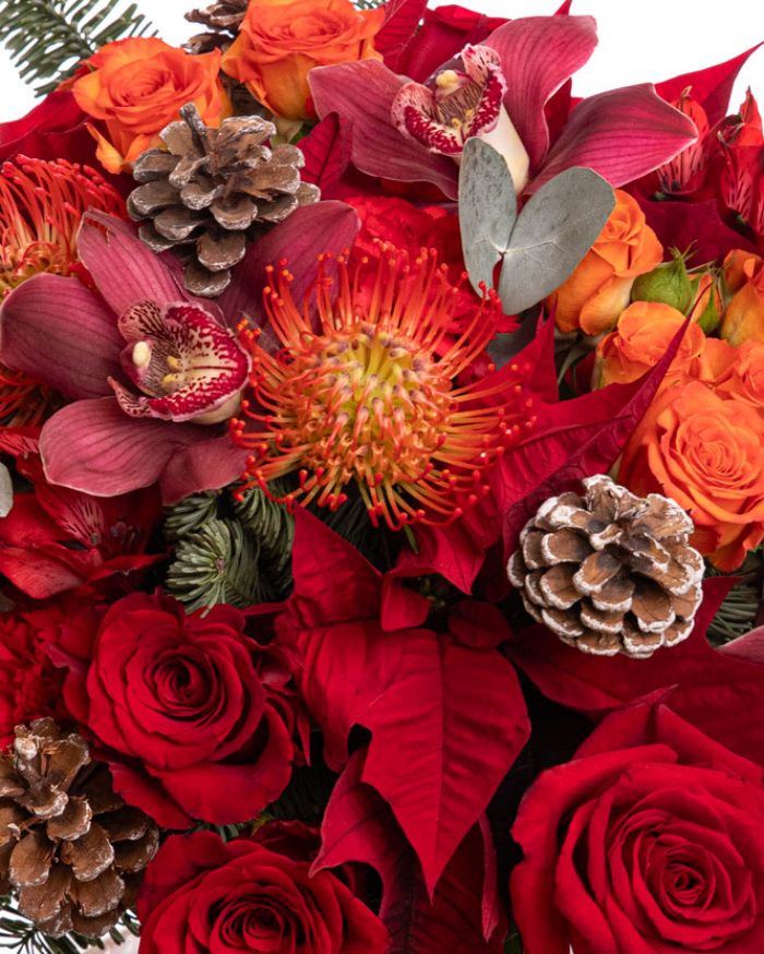 Winter bouquet with roses and pine cone