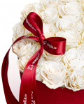 White roses in heart box