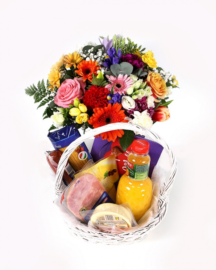 Tasty gift basket and colorful bouquet