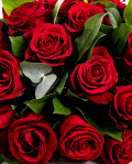 Funeral arrangement with red roses
