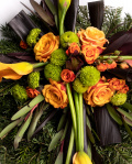 Funeral wreath with orange roses and callas
