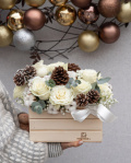 Roses arrangement with winter accessories