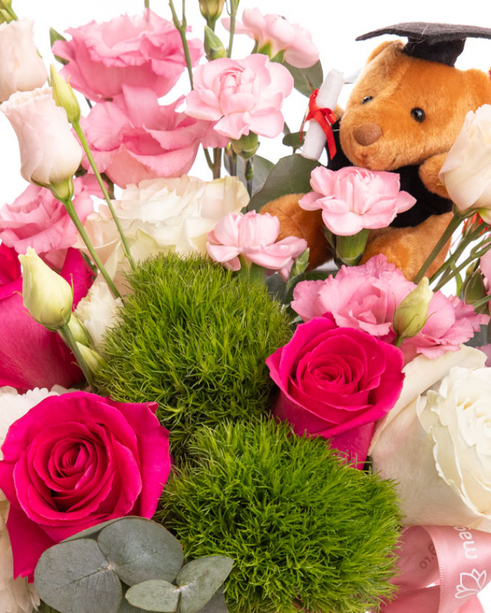 Graduation floral arrangement with roses and accessories