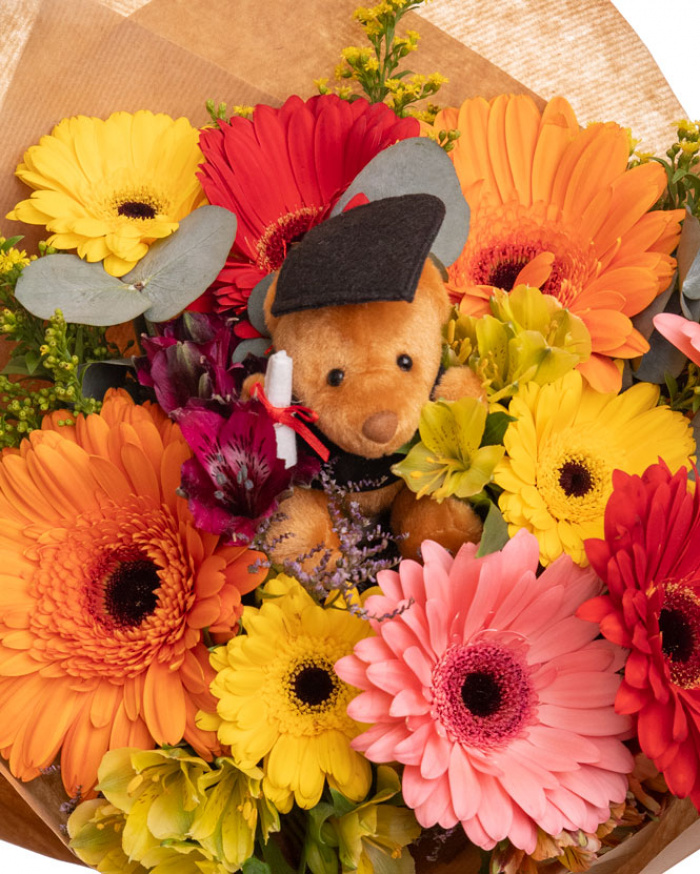 Graduation bouquet with colorful flowers and accessories
